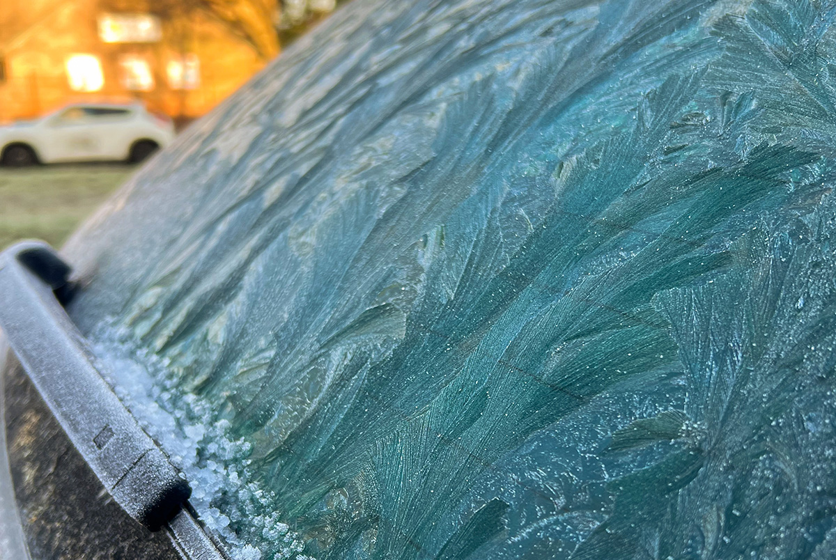Vehicle with close up view of early morning frost – a driving hazard.