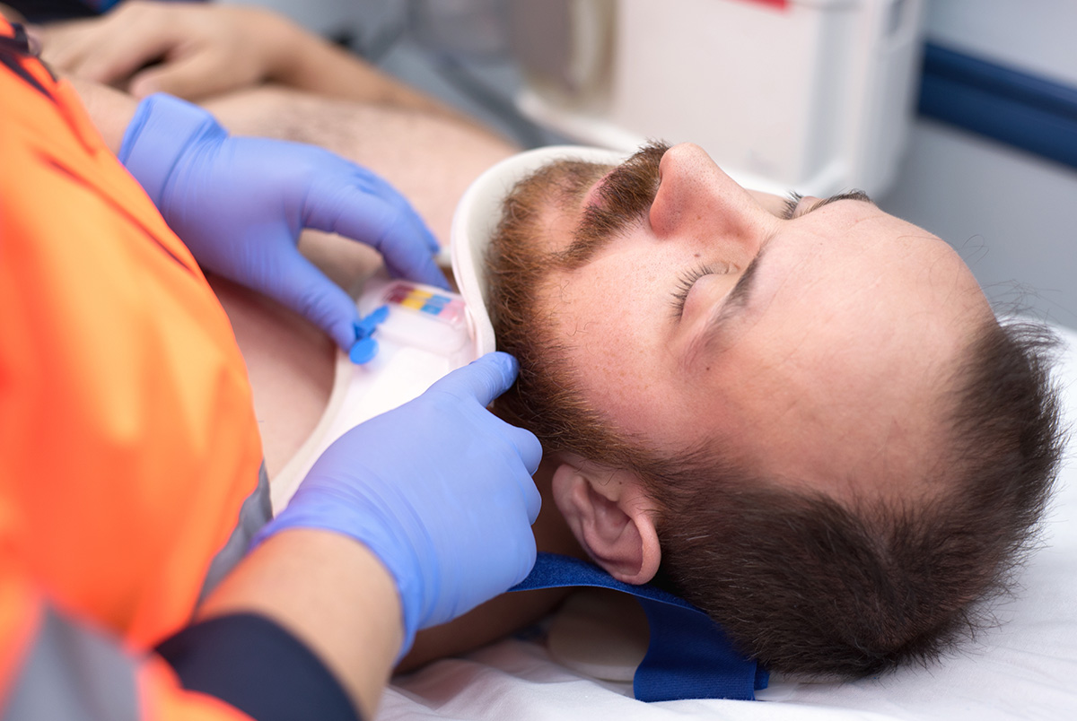 White man getting a neck brace put on. Symbolic for our slip and fall accident prevention tips.
